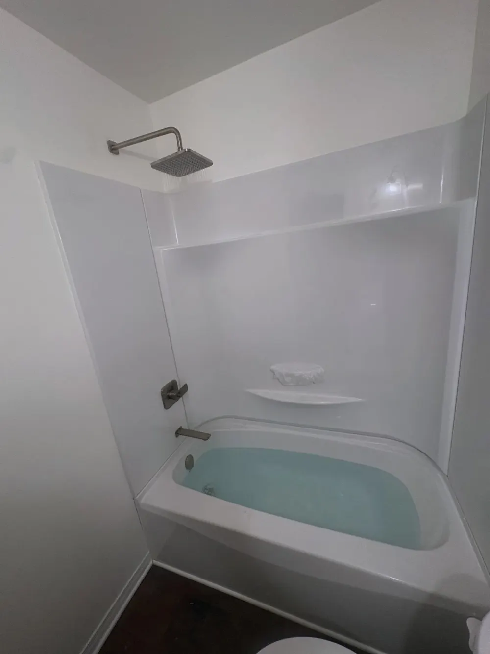 Finished cottage bathroom tub and shower install by Crofty's Plumbing & Off-Shore Services