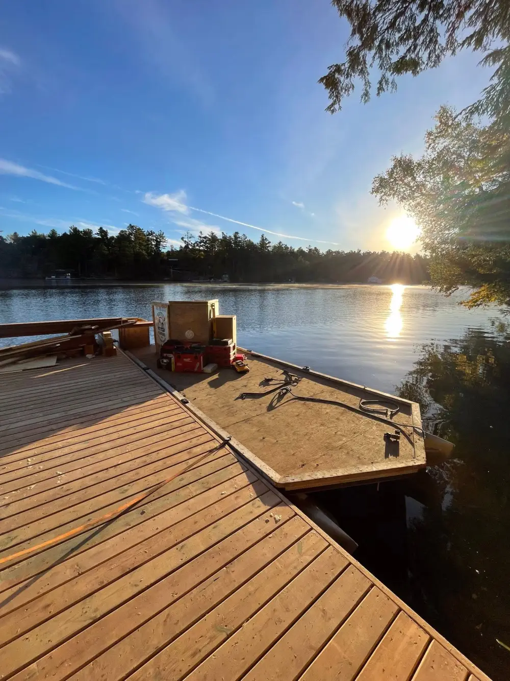 Muskoka cottage dock at sunrise staged for a spring cottage opening by Crofty's Plumbing