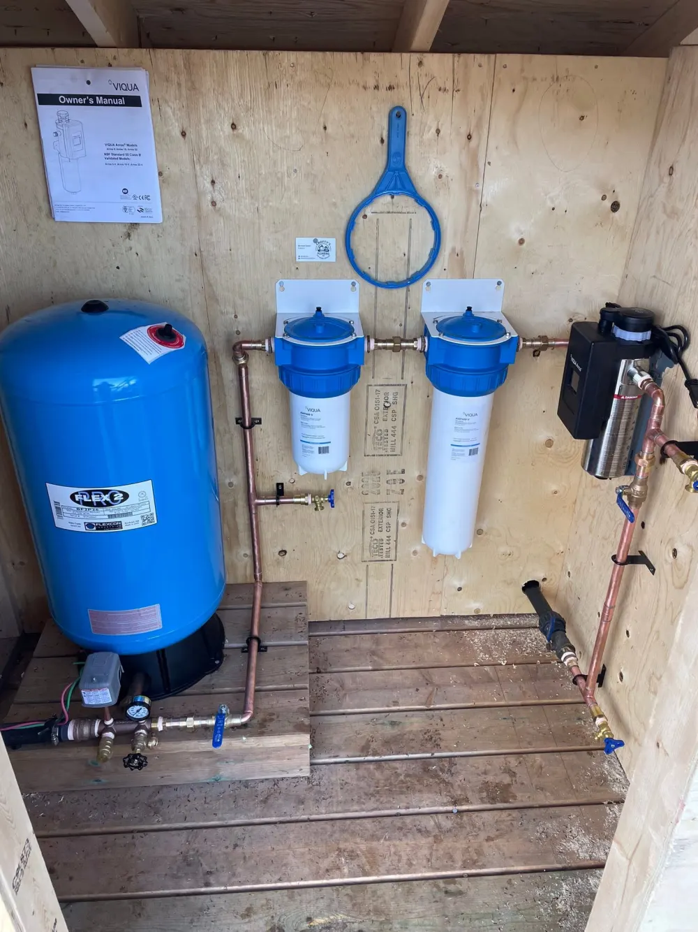 VIQUA UV water filtration system and pressure tank installed at a Muskoka cottage by Crofty's Plumbing
